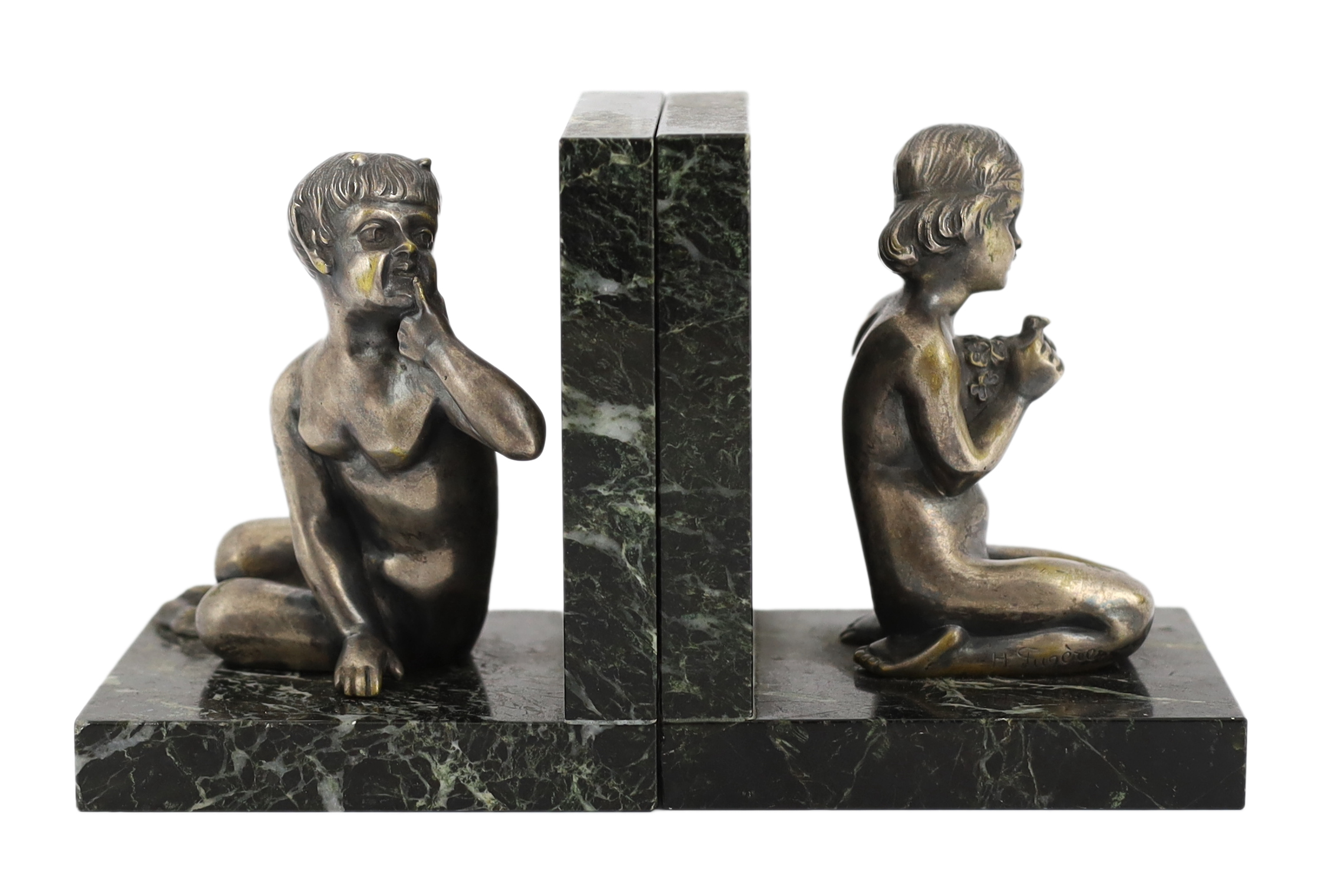 Henri Fugère, a pair of silvered bronze and marble bookends modelled as a kneeling faun and girl holding a posy of flowers, 11cm wide, 9cm deep, 13cm high